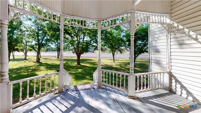 a view of a deck with a backyard