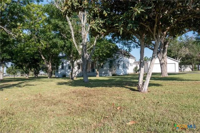 a house with trees in front of it