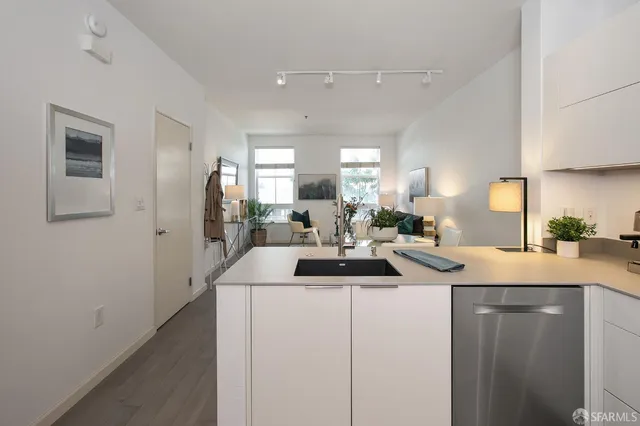 a kitchen with sink and window