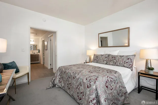 a bedroom with a bed and a couch