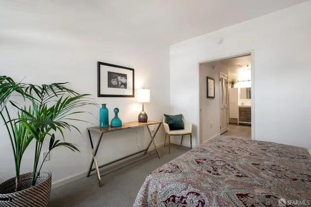 a bedroom with a bed and a couch