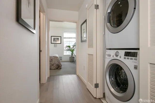 a view of a hallway with washer and dryer