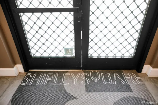a view of wooden floor with table and a chair