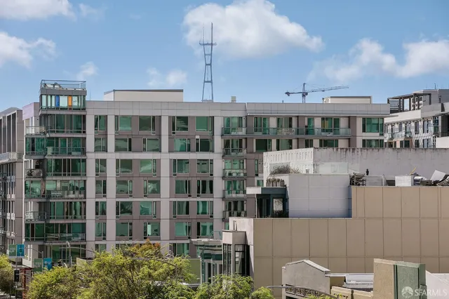 a front view of a building with glass windows and table