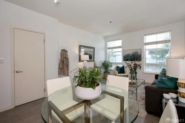 a dining room with furniture and wooden floor