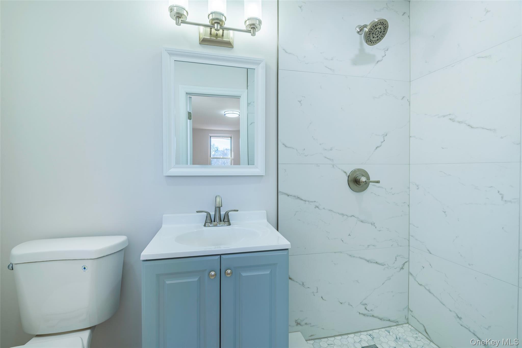 125 Bronx River Road, Unit 2E Yonkers, NY 10704 - Photo 16 of 31 a bathroom with a sink a toilet and shower