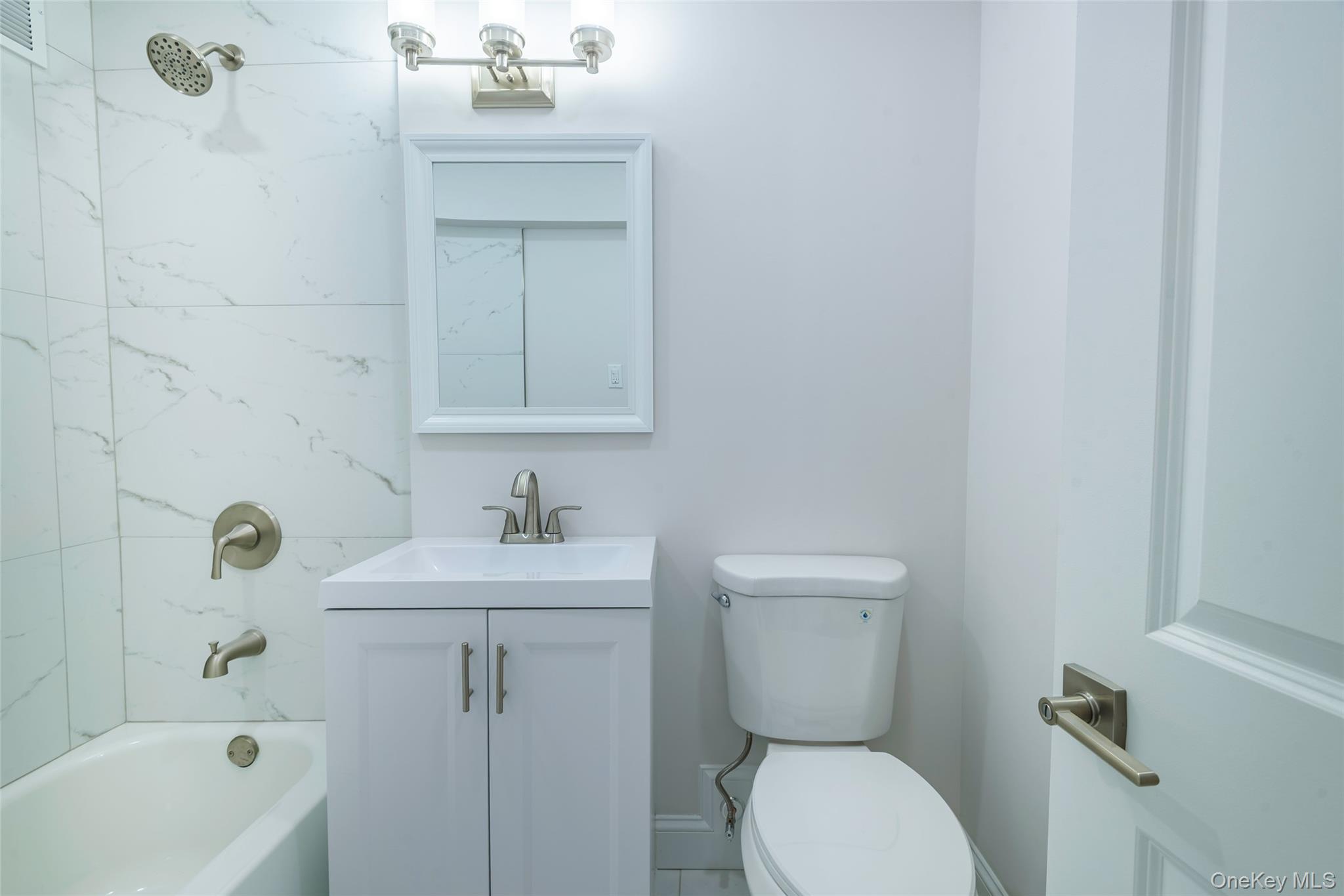 125 Bronx River Road, Unit 2E Yonkers, NY 10704 - Photo 17 of 31 a bathroom with a sink toilet and shower
