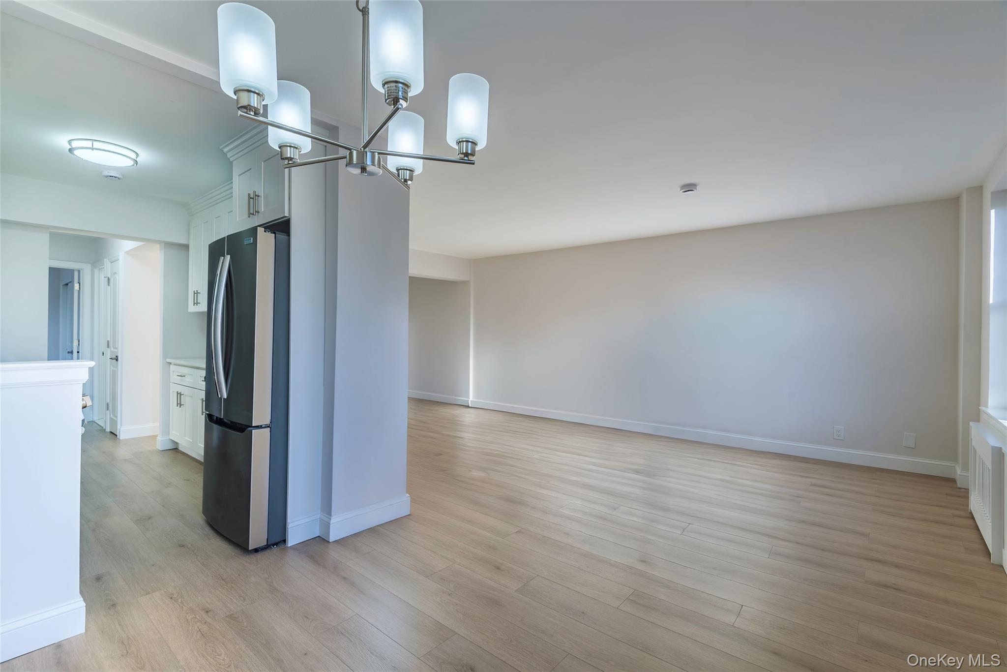 125 Bronx River Road, Unit 2E Yonkers, NY 10704 - Photo 7 of 31 a view of a room with wooden floor and staircase