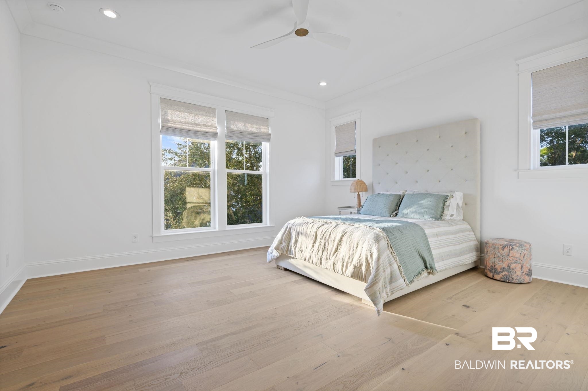 30313 River Road Orange Beach, AL 36561 - Photo 34 of 50 Bedroom featuring ornamental molding, multiple windows, light wood-style flooring, a ceiling fan, and recessed lighting