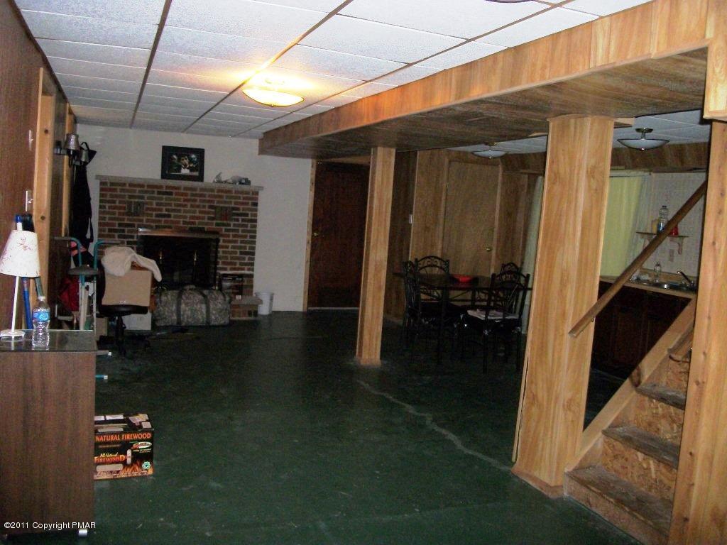 581 Wren Lane Bushkill, PA 18324 - Photo 12 of 16 a living room with furniture and a fireplace