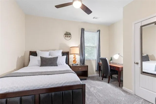 a bed room with a bed and a window