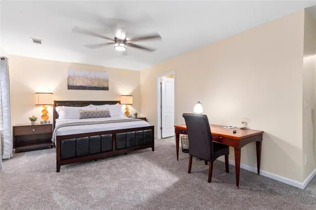 a bedroom with a bed and a table in it