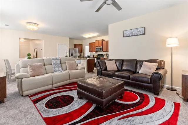 a living room with furniture and a rug