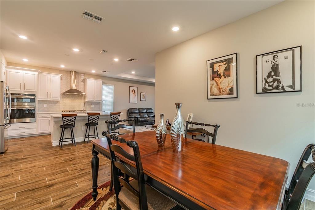 4738 Tramanto Lane Wesley Chapel, FL 33543 - Photo 22 of 45 a view of a dining room with furniture