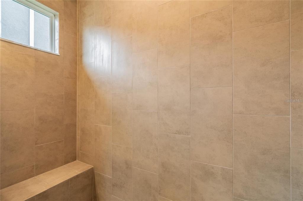 4738 Tramanto Lane Wesley Chapel, FL 33543 - Photo 29 of 45 a bathroom with a shower