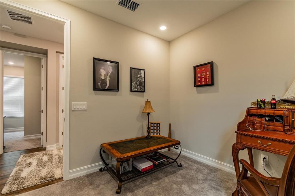 4738 Tramanto Lane Wesley Chapel, FL 33543 - Photo 35 of 45 a room with furniture and air hockey table