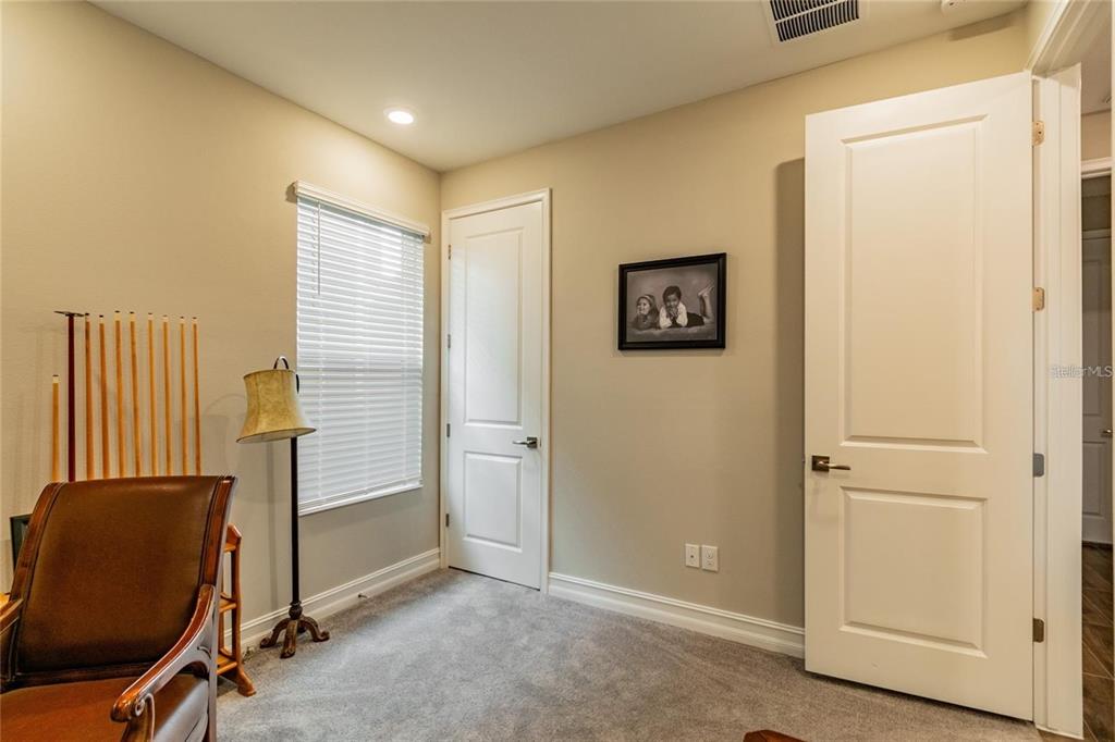 4738 Tramanto Lane Wesley Chapel, FL 33543 - Photo 36 of 45 an empty room with windows and stairs