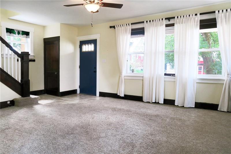 124 Ridgewood Avenue Pittsburgh, PA 15229 - Photo 4 of 21 Living Room: 14x21, wood-slat blinds.