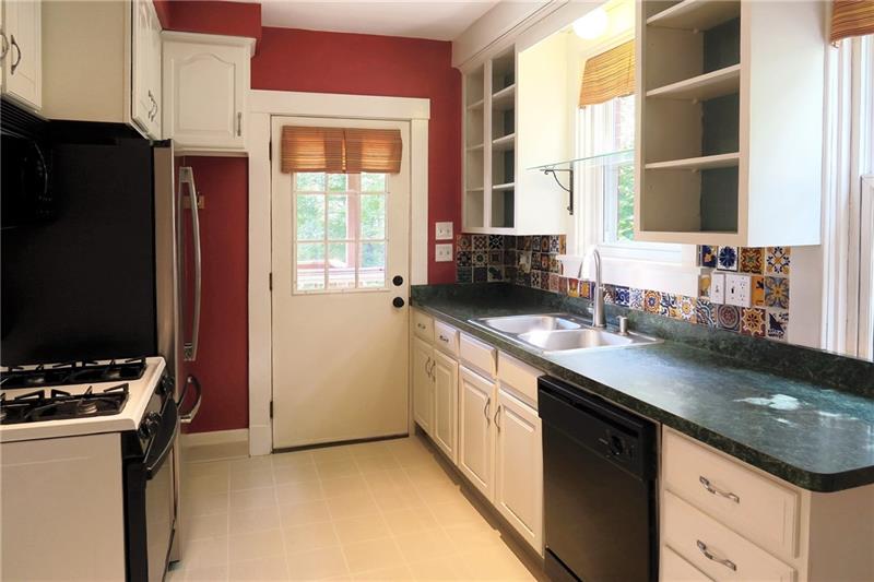 124 Ridgewood Avenue Pittsburgh, PA 15229 - Photo 9 of 21 Kitchen: 9x14, back door leads to HUGE covered deck.