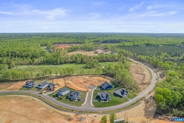 an aerial view of a house with outdoor space and city view