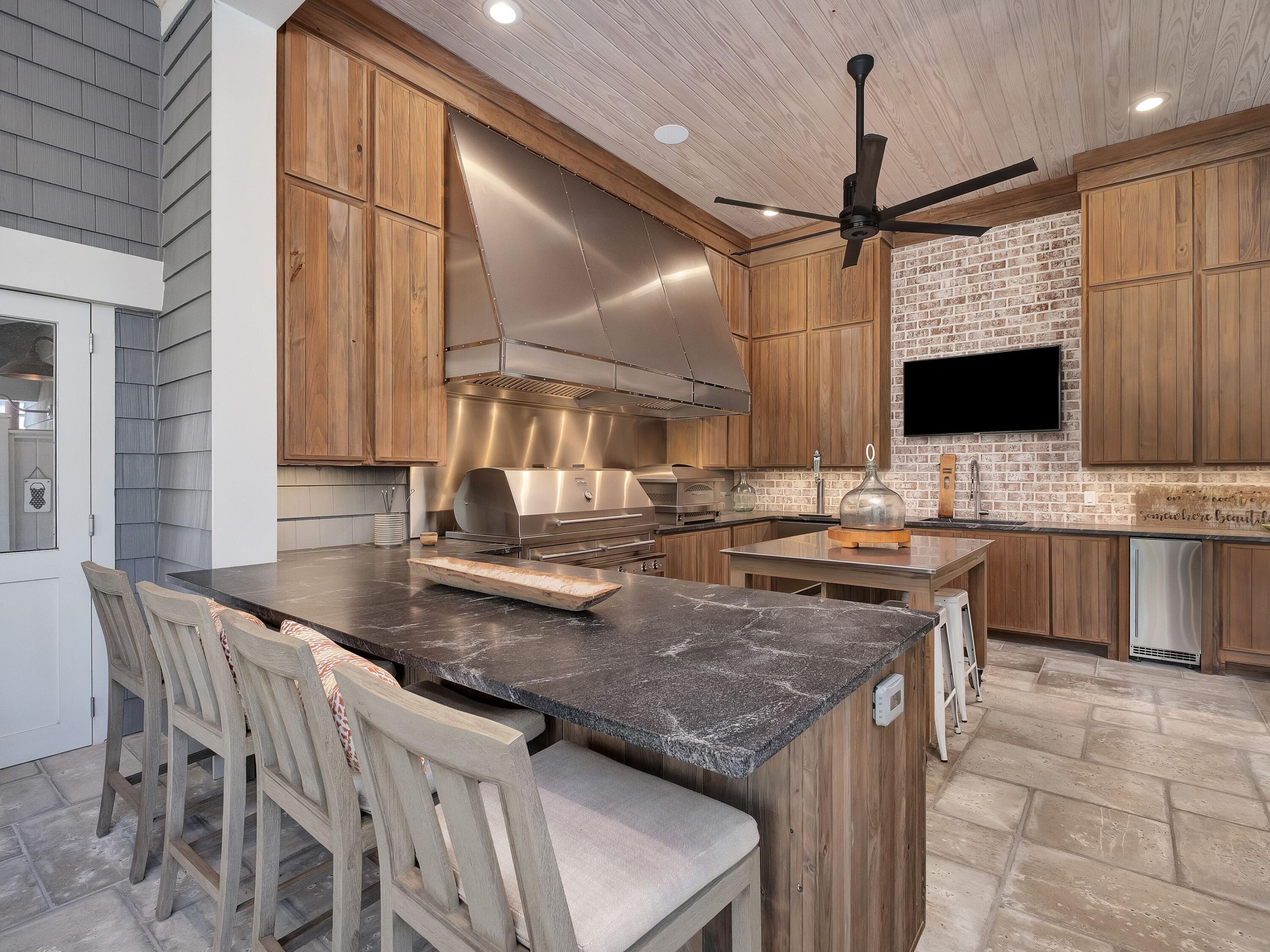 179 Brenda Ln Inlet Beach Inlet Beach, FL 32461 - Photo 23 of 63 a kitchen with a stove a sink and a refrigerator