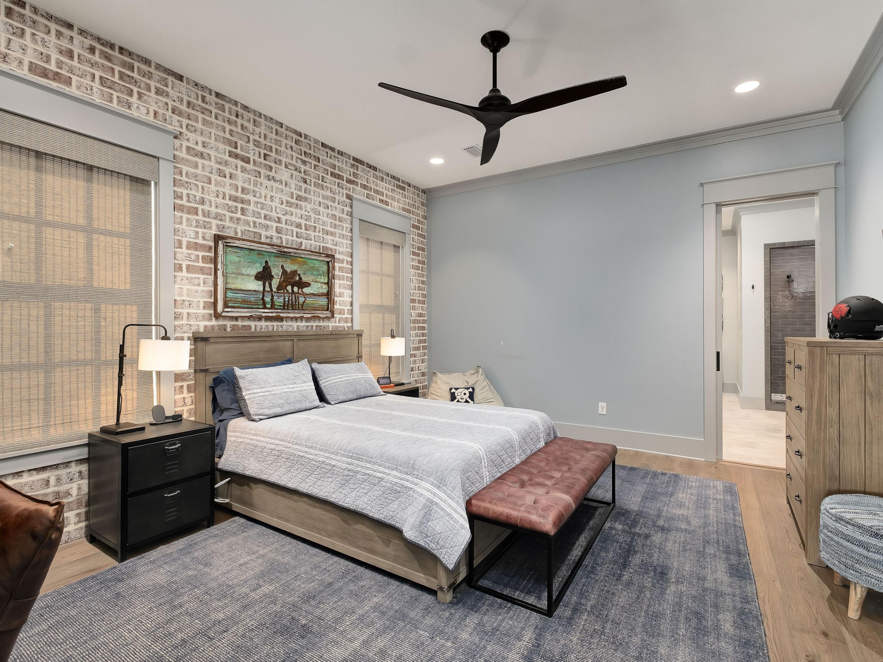 179 Brenda Ln Inlet Beach Inlet Beach, FL 32461 - Photo 45 of 63 a bedroom with a bed and a dresser with mirror