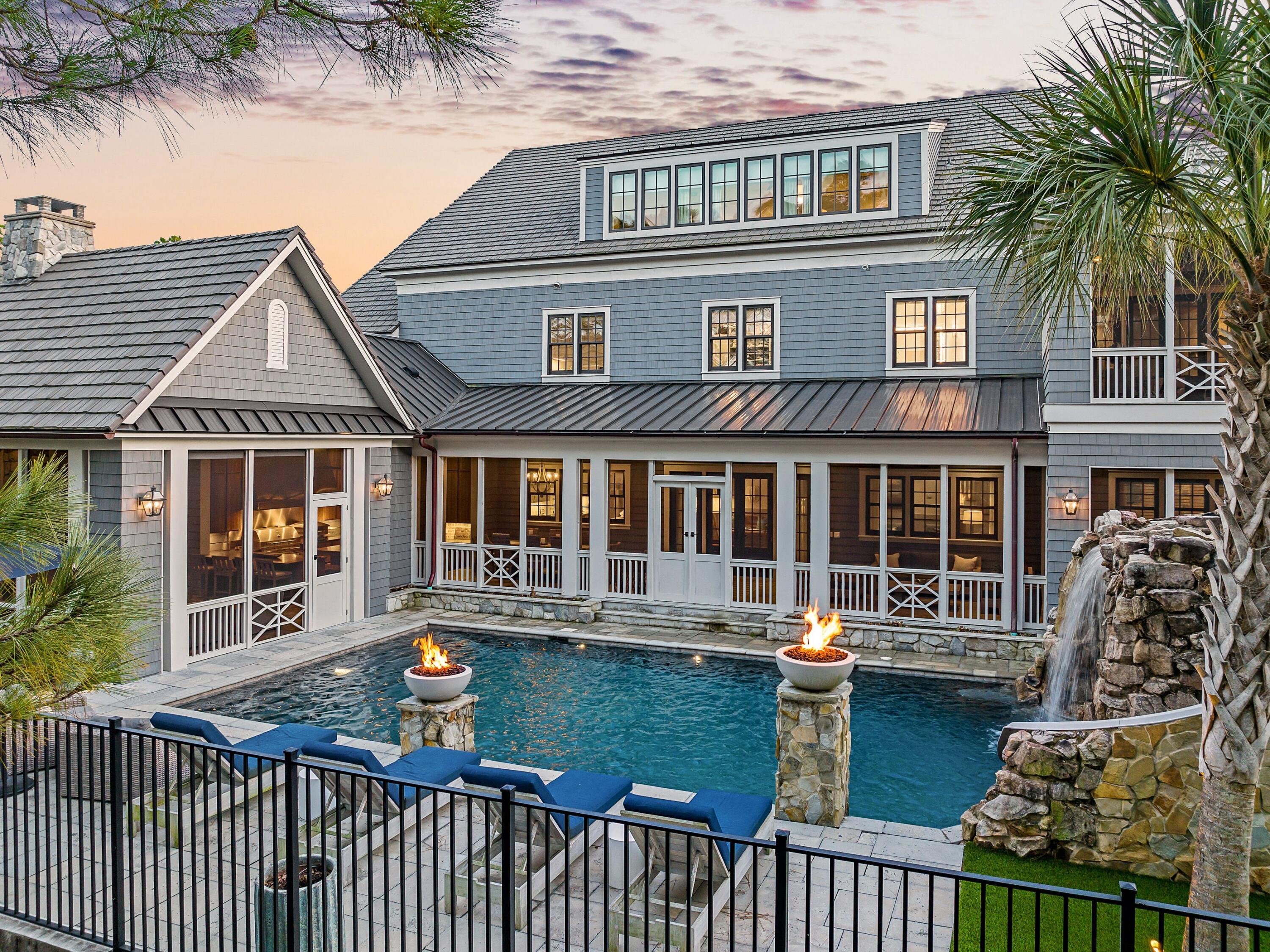 179 Brenda Ln Inlet Beach Inlet Beach, FL 32461 - Photo 57 of 63 a front view of a house with a garden and patio