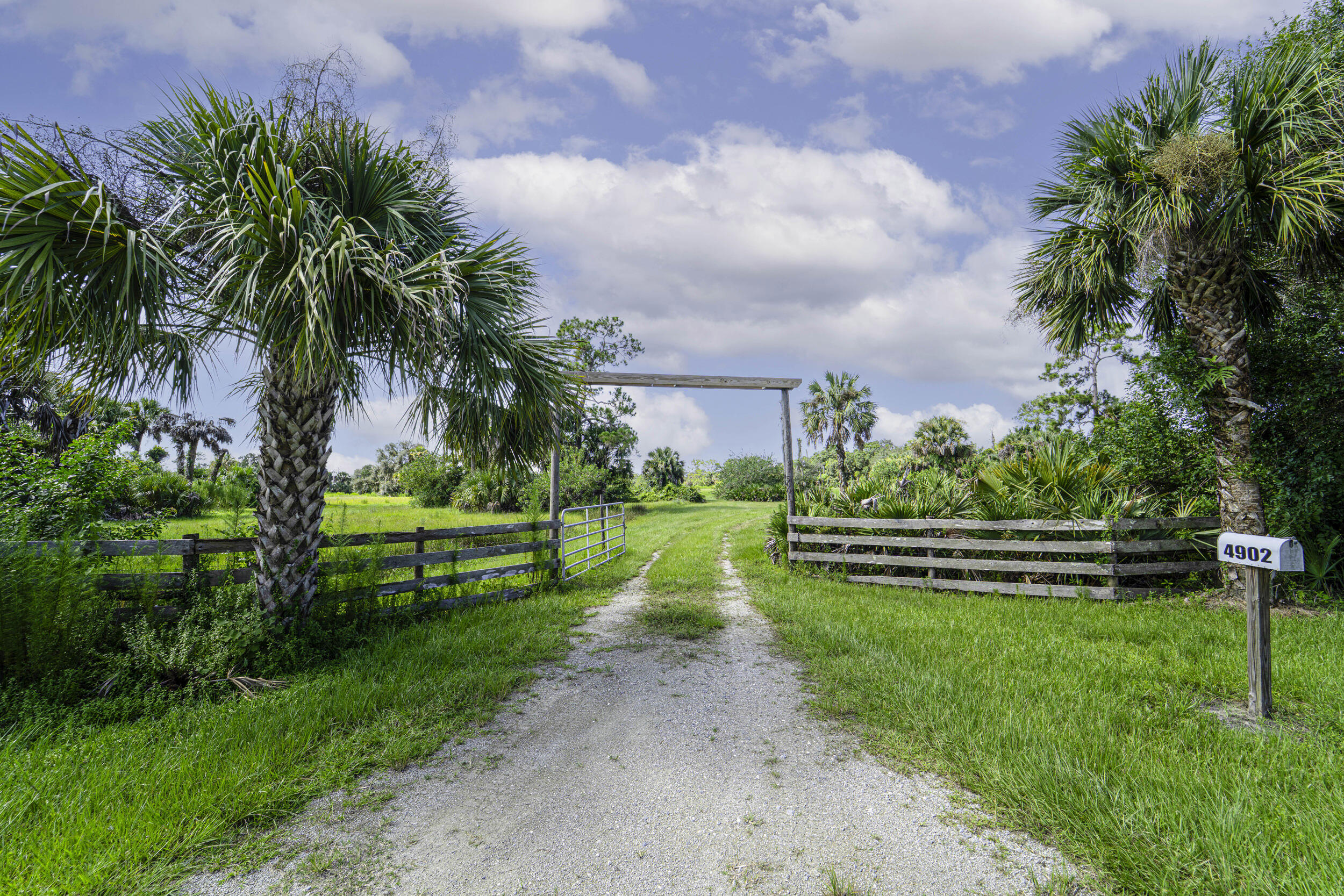 4902 Southwest Wild Turkey Lane Okeechobee, FL 34974 - Photo 1 of 17 a view of a park with large trees