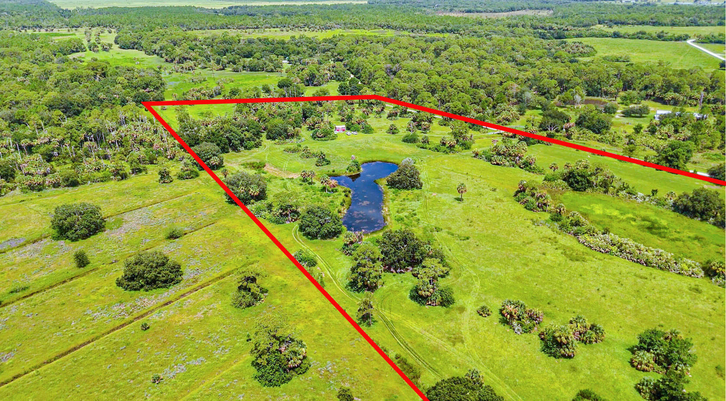 4902 Southwest Wild Turkey Lane Okeechobee, FL 34974 - Photo 3 of 17 a picture of mountains with an outdoor space