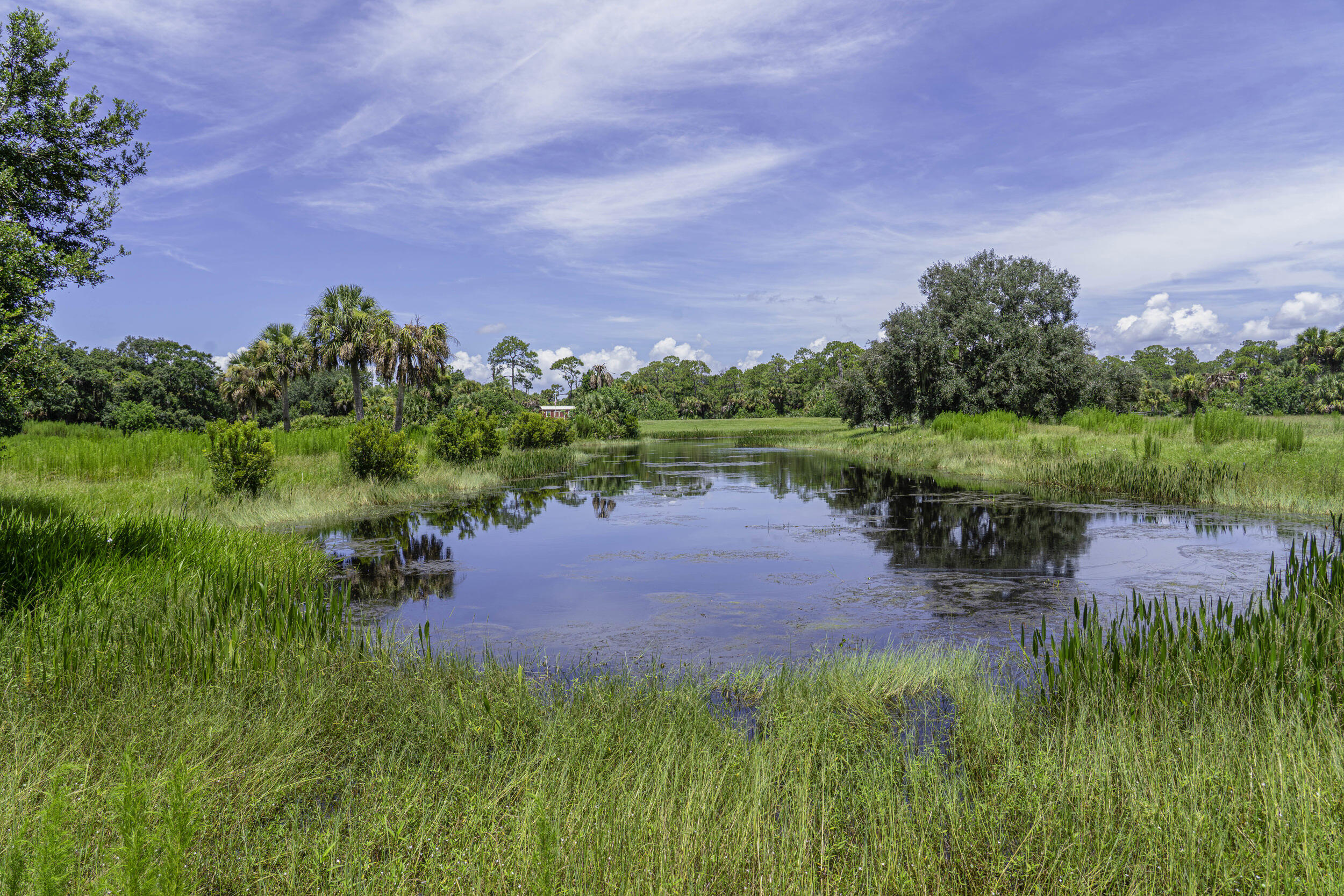 4902 Southwest Wild Turkey Lane Okeechobee, FL 34974 - Photo 6 of 17 a view of a lake with a yard and lake view