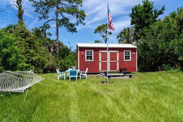 a view of a garden with a building in the background