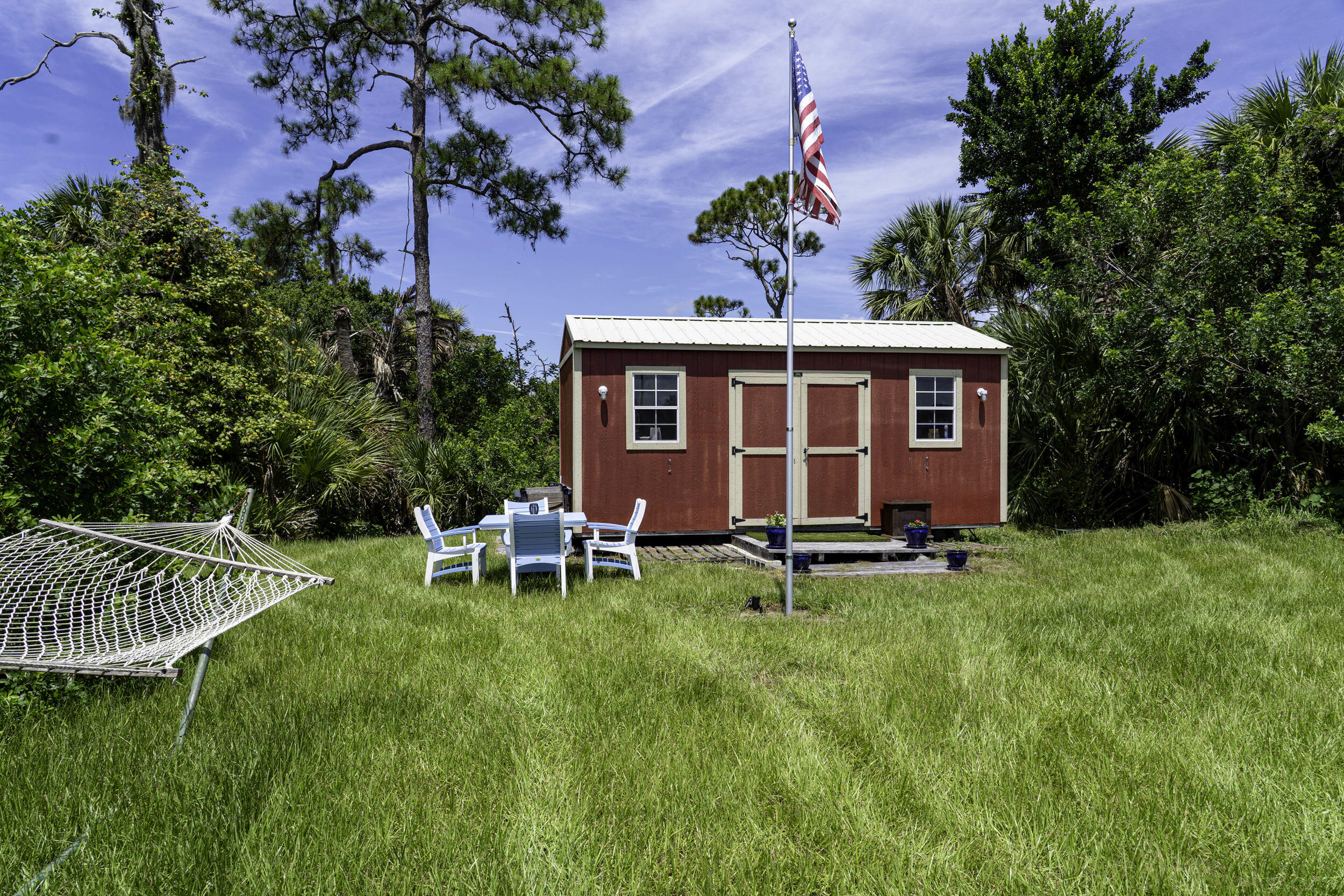 4902 Southwest Wild Turkey Lane Okeechobee, FL 34974 - Photo 7 of 17 a front view of a house with garden