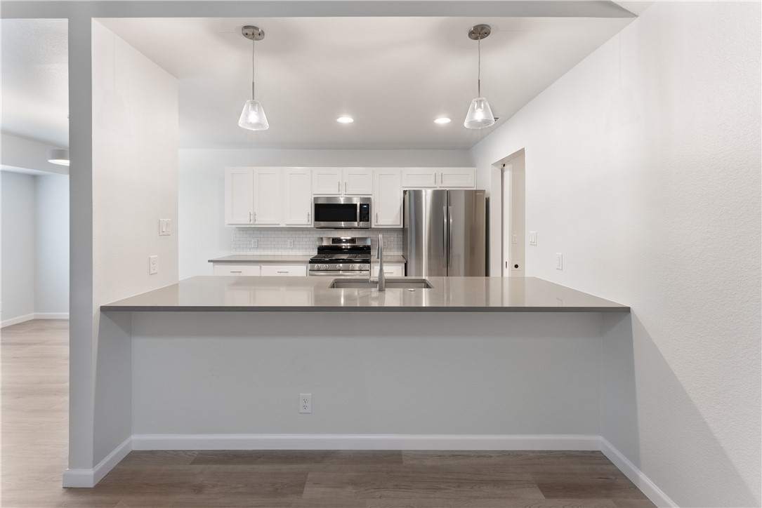 707 Central Drive Georgetown, TX 78628 - Photo 2 of 30 a view of kitchen with microwave and cabinets