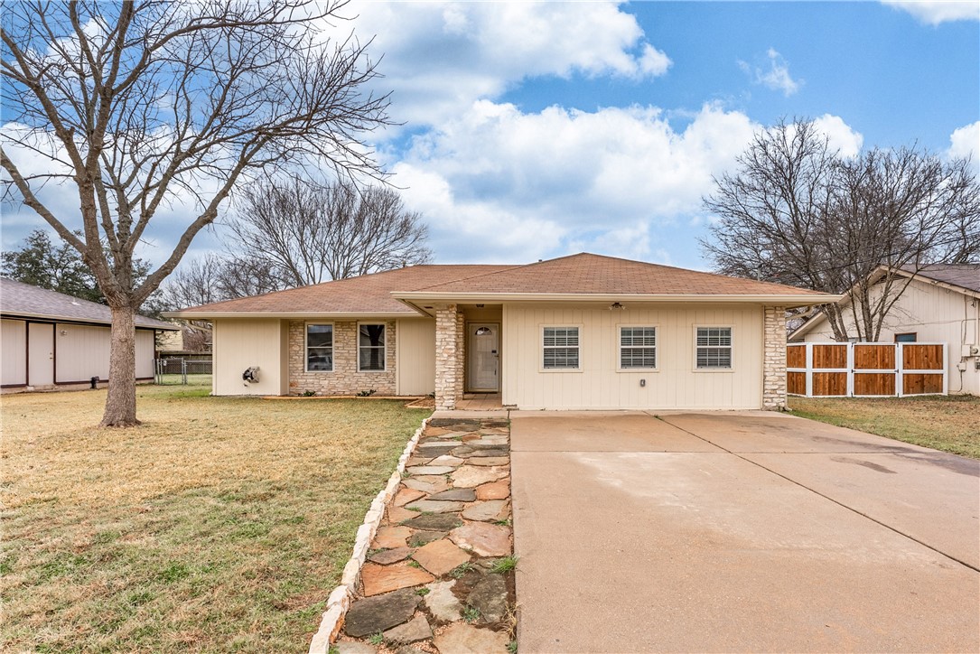 707 Central Drive Georgetown, TX 78628 - Photo 5 of 30 a front view of a house with a yard