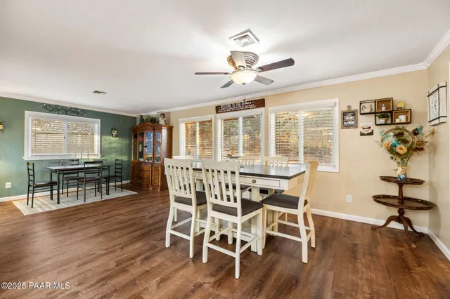 a view of a livingroom with furniture and a flat screen tv