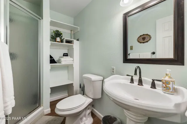 a view of a backyard with a table and chairs