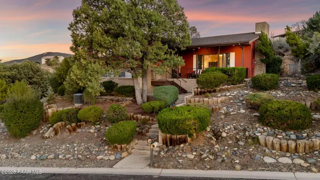 a view of a house with a tree