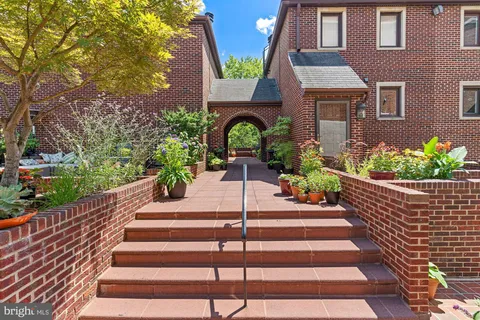 a view of a house with a bench