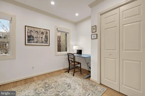 a bed room with a bed and a chandelier