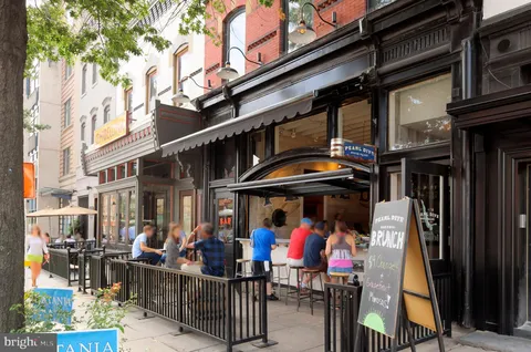 a view of a food market with retail shops