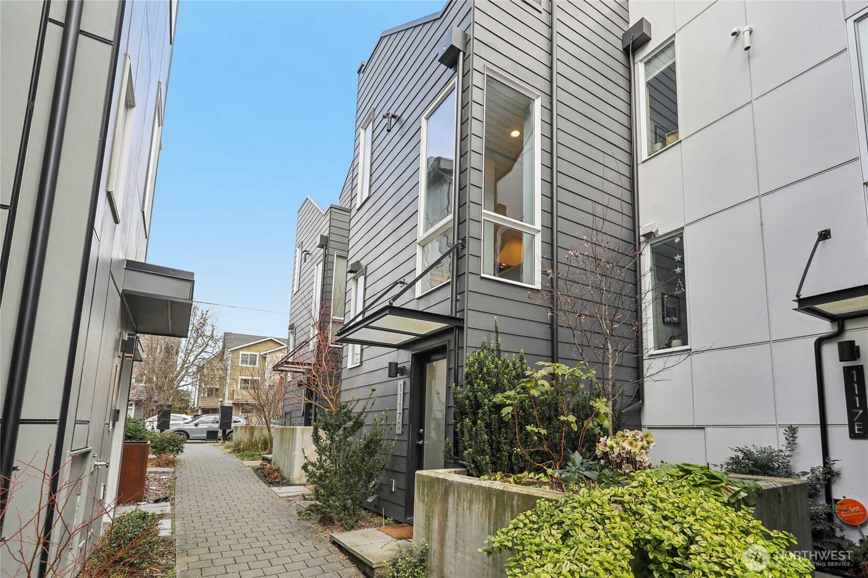 a view of a house with yard and sitting area