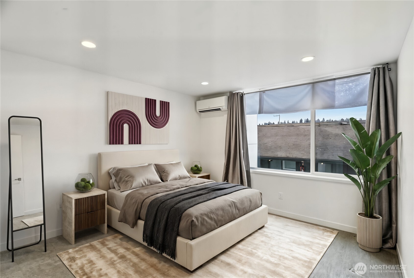 1117 Northwest 56th Street, Unit D Seattle, WA 98107 - Photo 13 of 32 a bedroom with a large bed and a large window