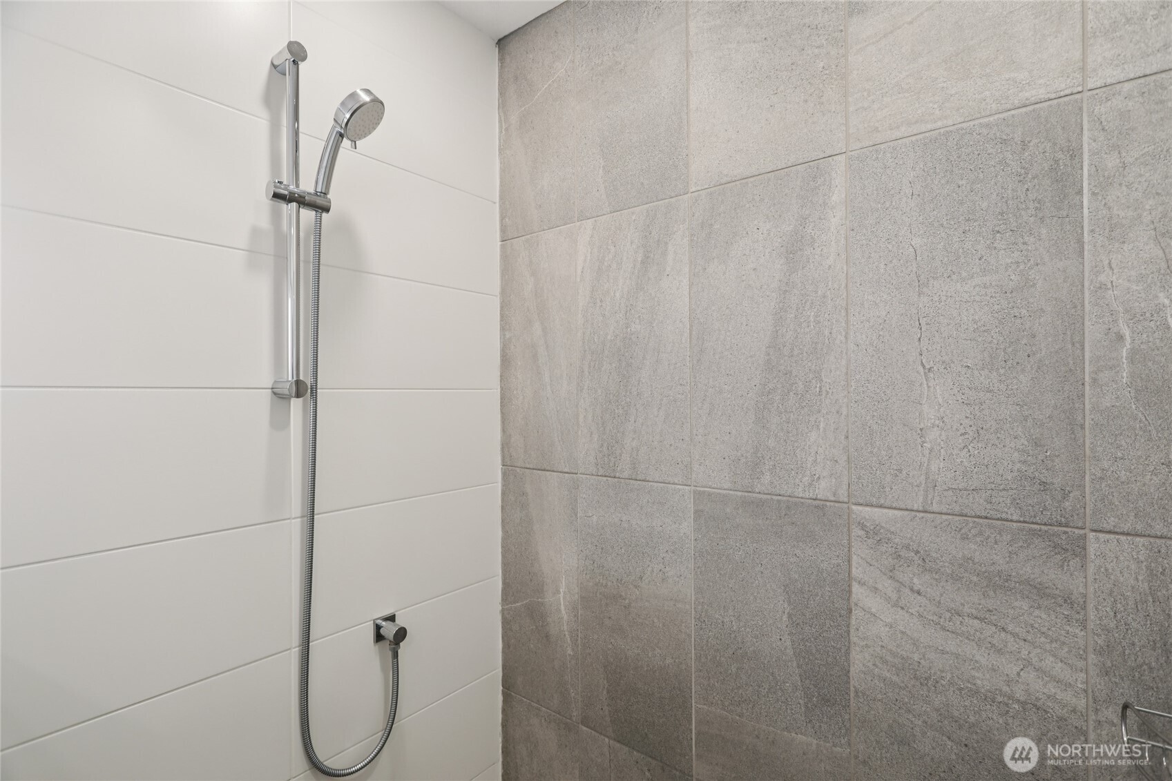 1117 Northwest 56th Street, Unit D Seattle, WA 98107 - Photo 17 of 32 a bathroom with a shower