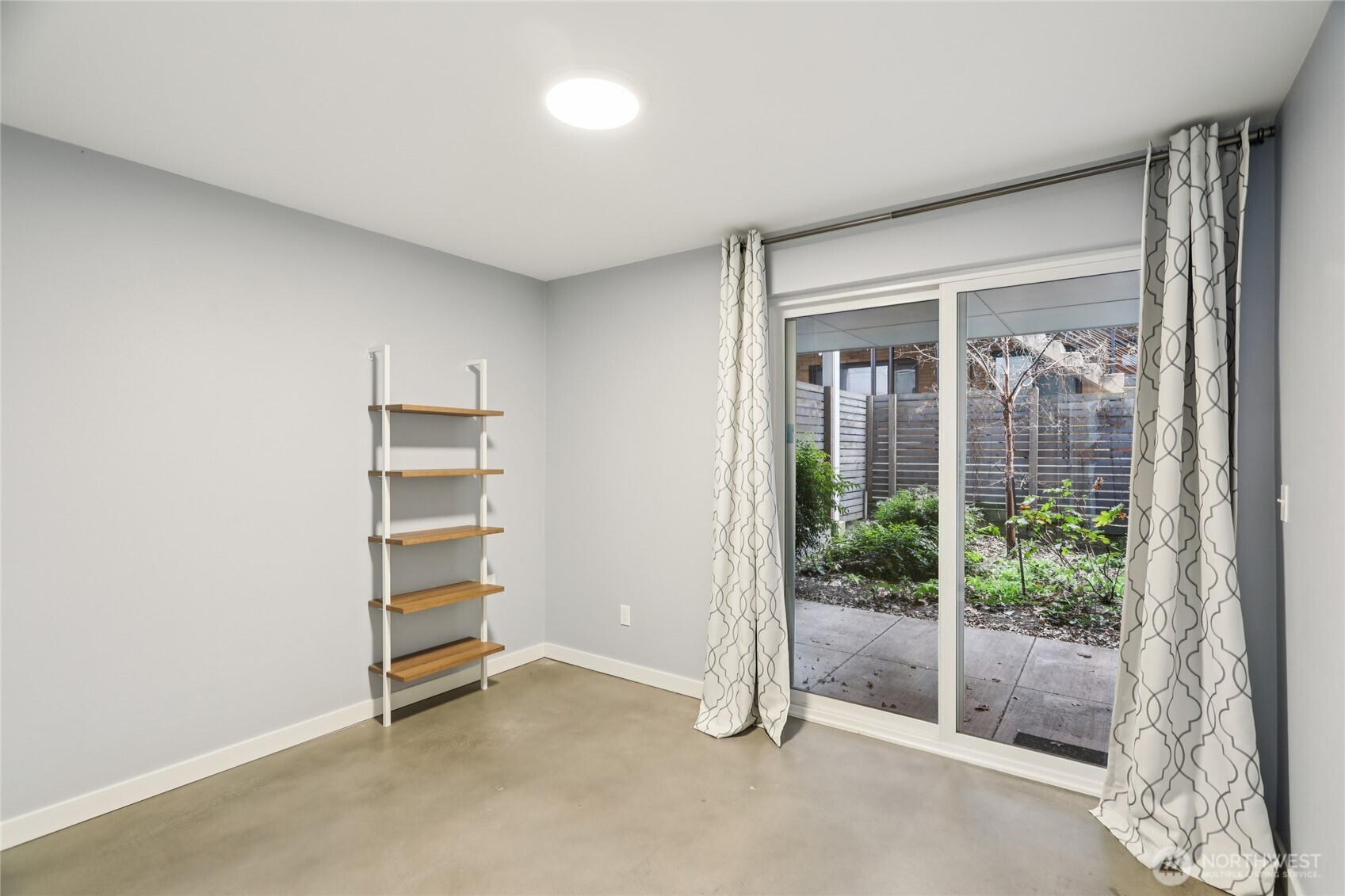 1117 Northwest 56th Street, Unit D Seattle, WA 98107 - Photo 20 of 32 a view of room with balcony and wooden floor