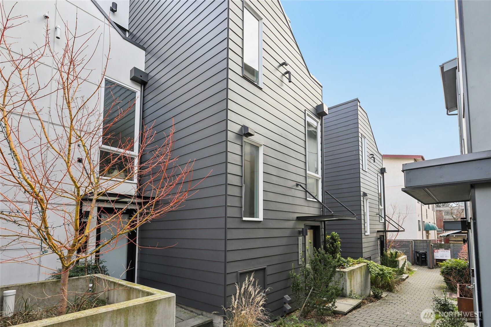 1117 Northwest 56th Street, Unit D Seattle, WA 98107 - Photo 31 of 32 a view of house with a tree