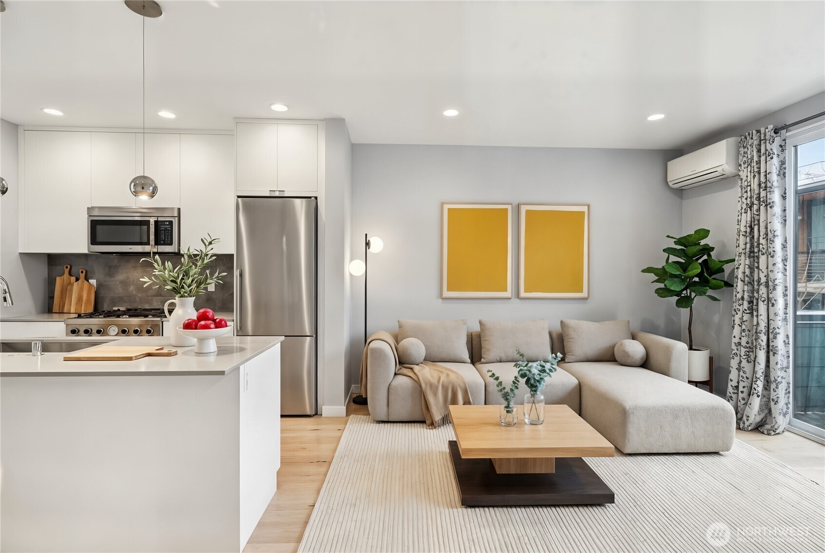 1117 Northwest 56th Street, Unit D Seattle, WA 98107 - Photo 7 of 32 a living room with kitchen furniture and a wooden floor