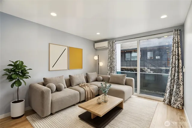 a living room with furniture and a large window