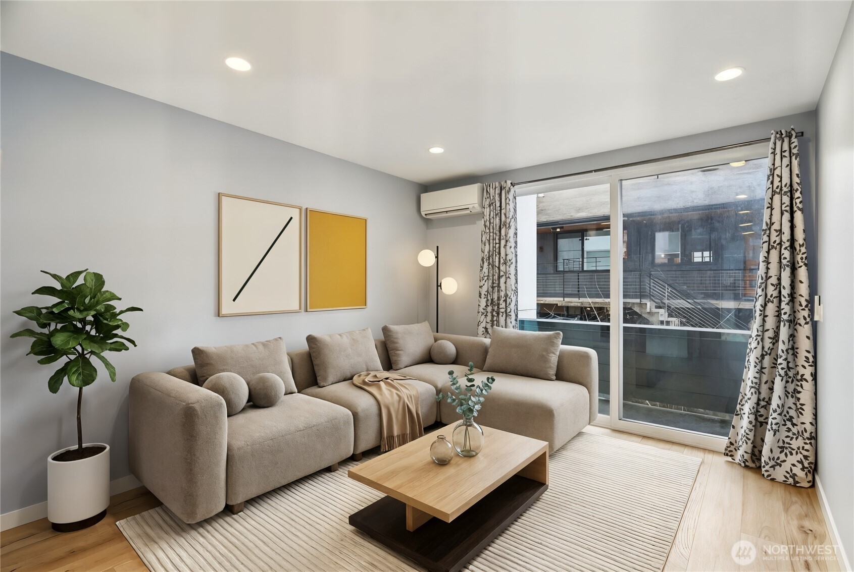 1117 Northwest 56th Street, Unit D Seattle, WA 98107 - Photo 8 of 32 a living room with furniture and a large window