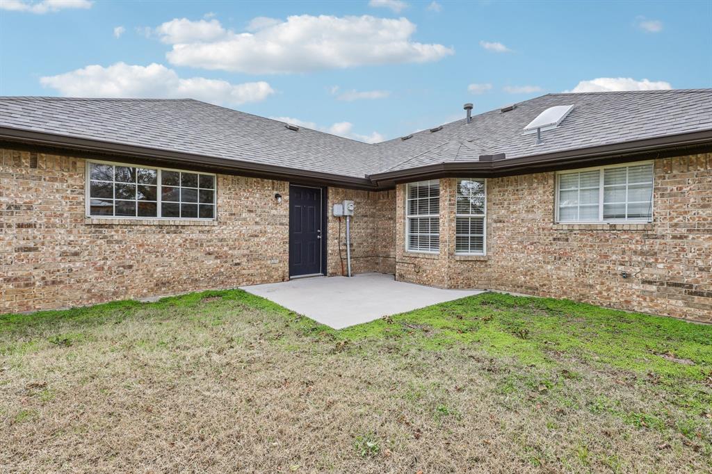 320 Edgewood Street Krum, TX 76249 - Photo 25 of 29 a front view of a house with a yard