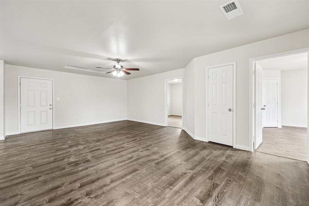 320 Edgewood Street Krum, TX 76249 - Photo 5 of 29 wooden floor in an empty room